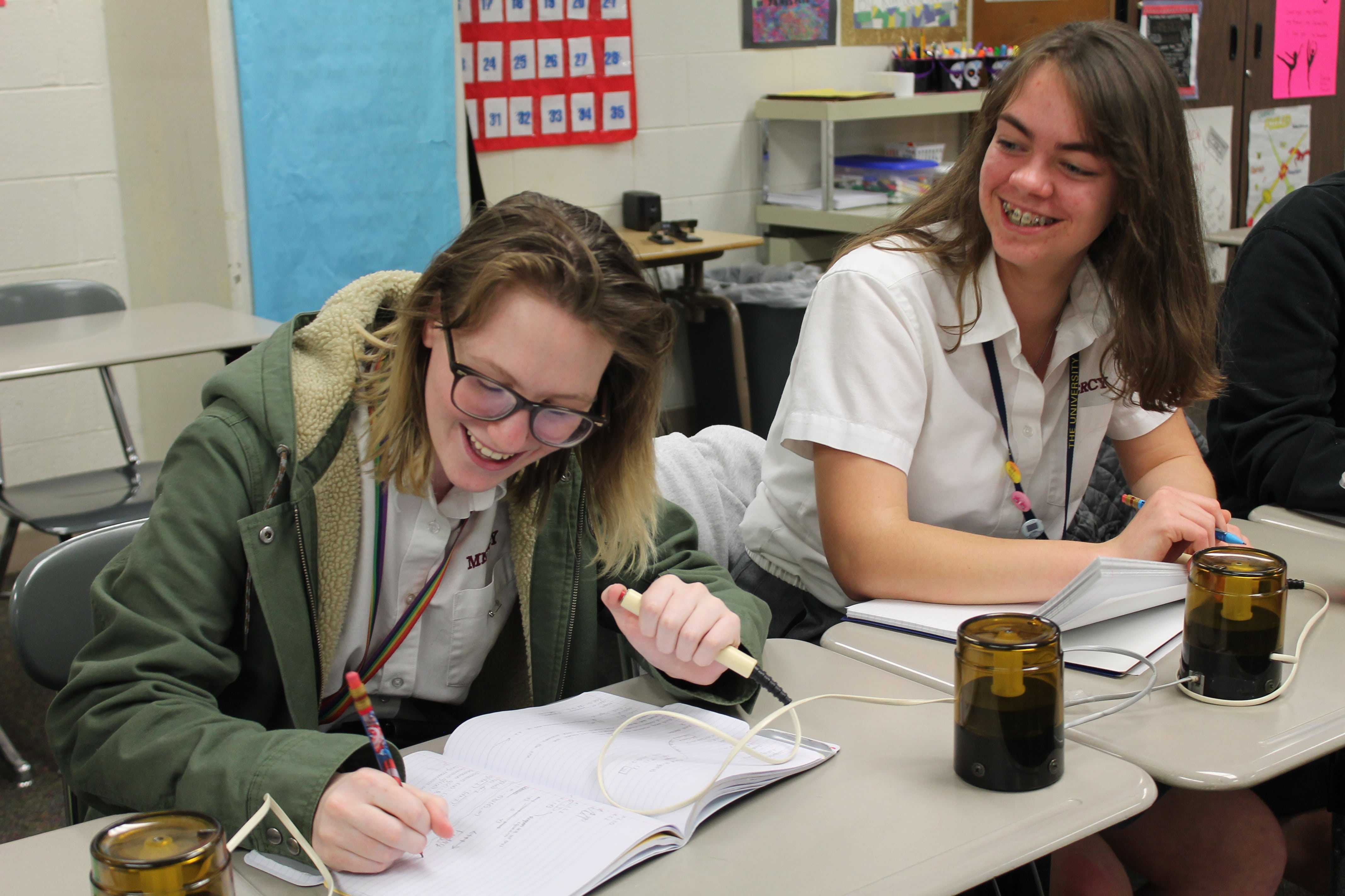 Senior Grace Salzeider uses her buzzer to signal that she has an answer to the question asked. (Photo Credit: Clarisa Russenberger)