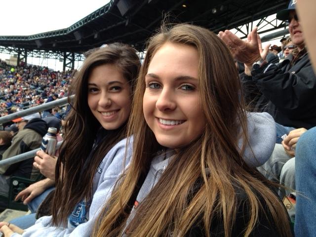 Seniors Katie Horn and Grace Martin cheer on the Tigers.