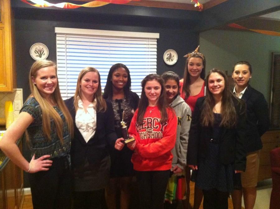 Mercys+Mock+Trial+team+shows+off+their+Honorable+Mention+trophy+after+their+regional+competition.++Photo+Credit%3A+Ann+Winn