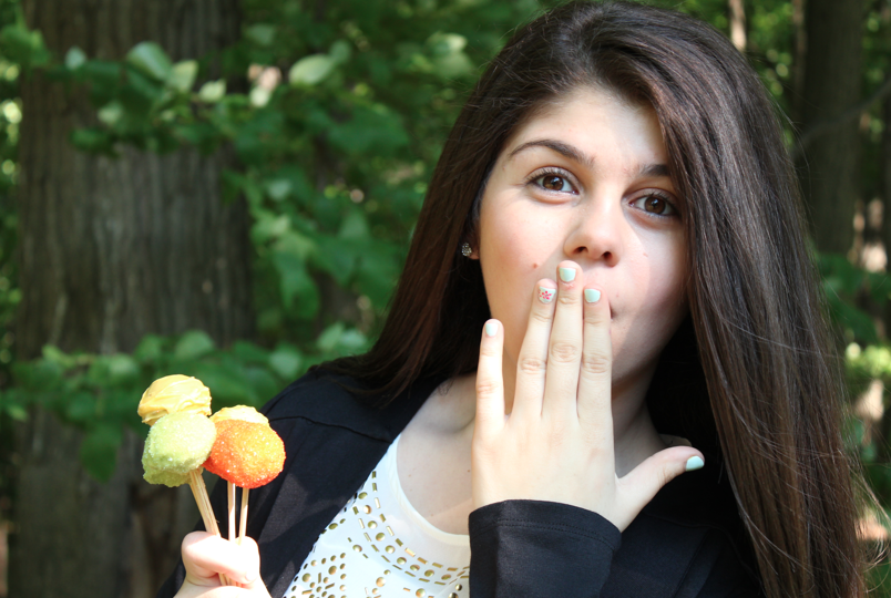 Junior Sanan Malkadjian advertises her cake pops.  Photo Credit: Sanan Malkadjian 