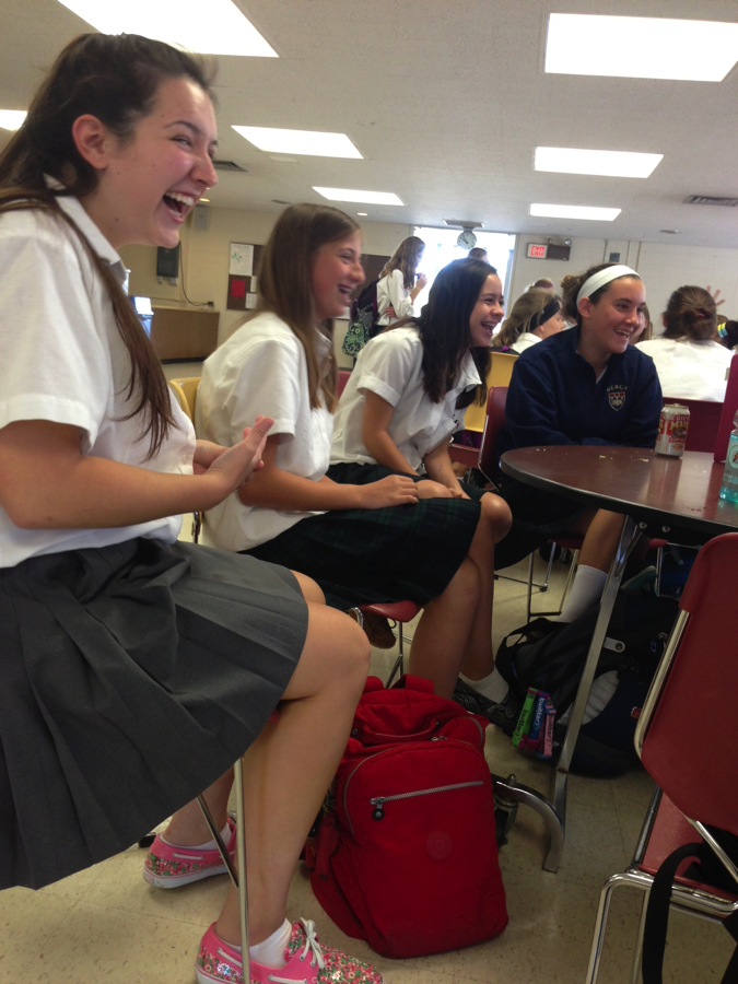 Senior Natalie Lewandowski shares a laugh with friends she made in her freshmen Gym Swim class.