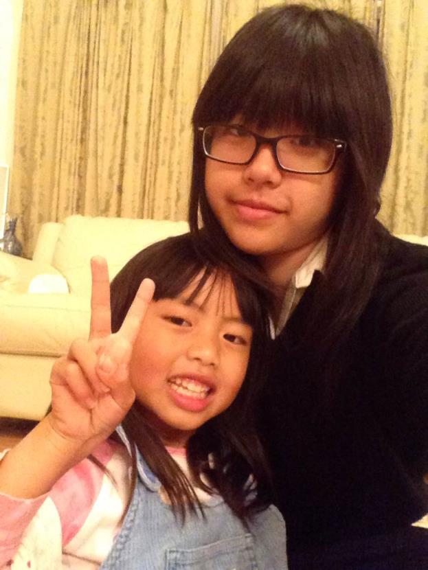 Siyi (top) hangs out and poses with her cousin (bottom).  Photo Credit: Siyi Xu