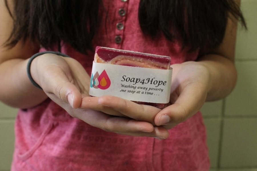 Hakim, 14, makes a large variety of soaps and candles which alternate with the seasons (Photo Credit: Theresa Benton). 