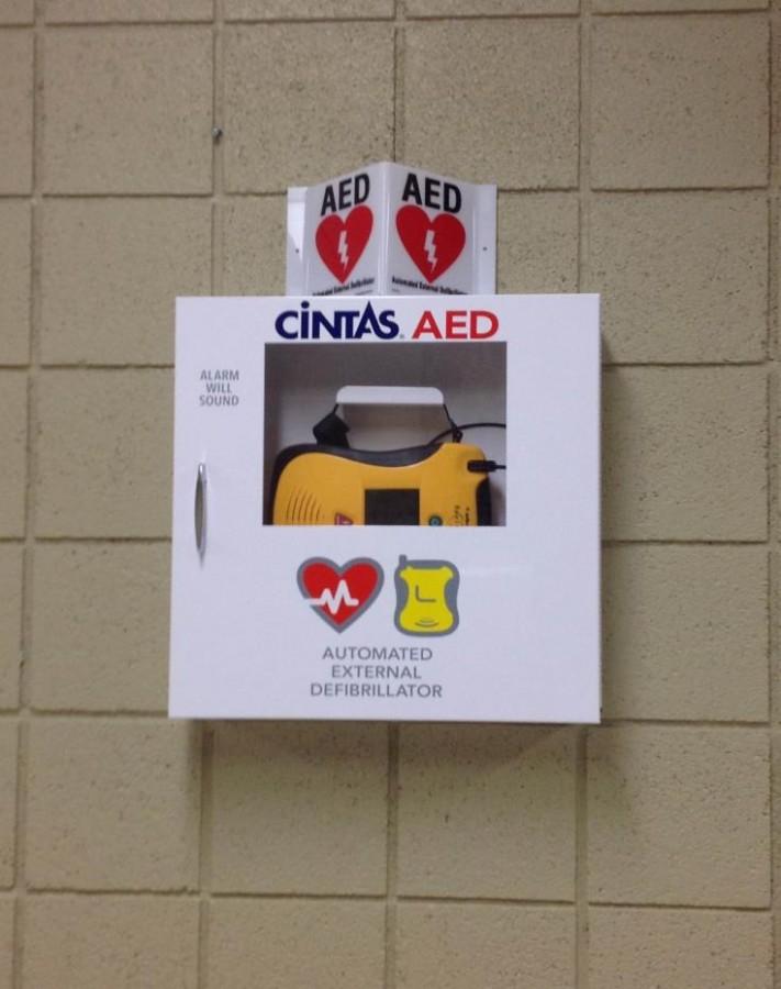 Mercys brand new AEDs hang in five places around the school.  This one is placed near the reception area (Photo Credit: Katie Birecki). 