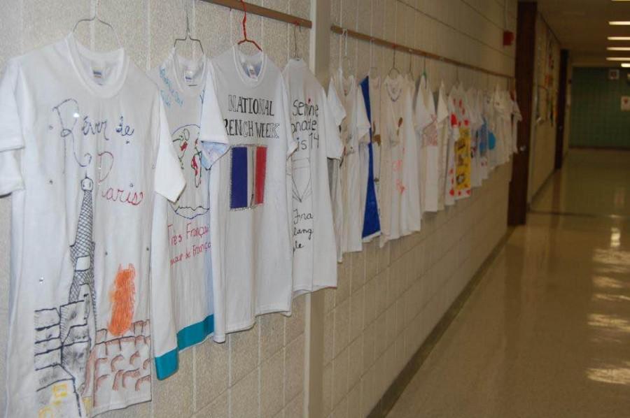T-shirts made by students in French classes line language hall for National French Week (Photo Credit: Paisley Sutton). 