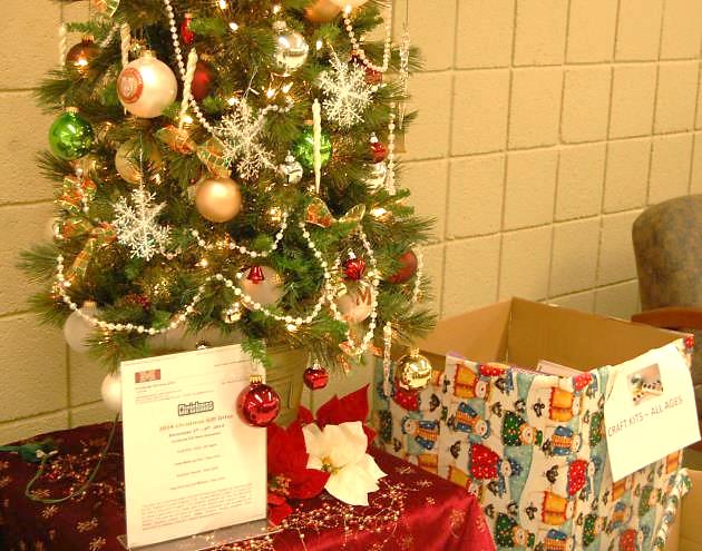 The Christmas Gift Drive ends Dec. 8 at noon when organizations arrive to pack the gifts under the Reception Area Christmas tree (Photo Credit: Theresa Walle). 
