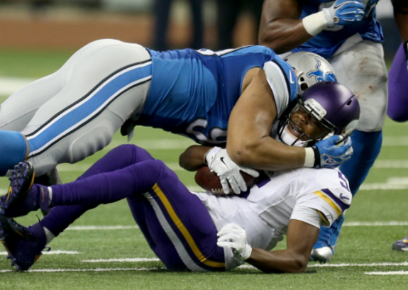 Ndamukong Suh sacks Minnesota Vikings quarterback Teddy Bridgewater on Dec. 14, 2014 at Ford Field in Detroit. (Photo Credit: MCT Wire Service). 