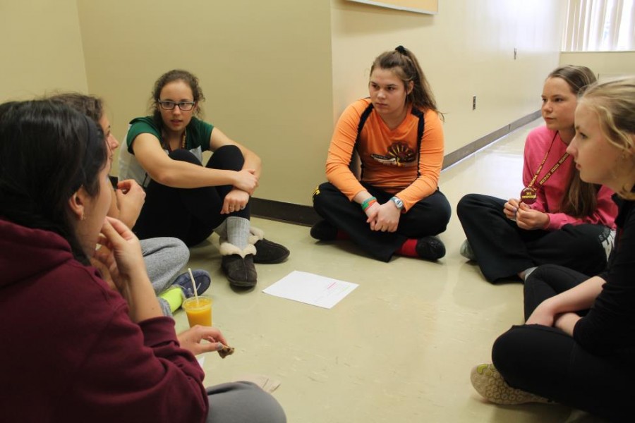 Students discuss personal pro-life experiences with club leaders Cari Padula and Natalie Cieslak  (Photo credit: Emma Mallon).