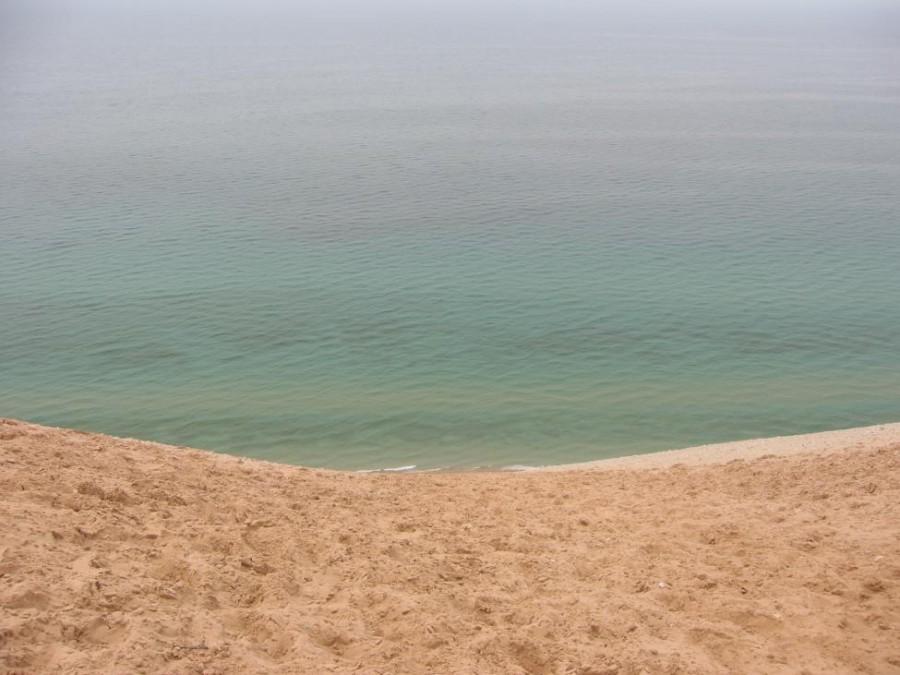 Lake Michigan, the third largest Great Lake, currently holds such clear water due to melting ice and the zebra mussels and quagga that have provided filtration, allowing the bottom of the lake to be seen vividly from the sky (Photo Credit: Danya Ziazadeh).