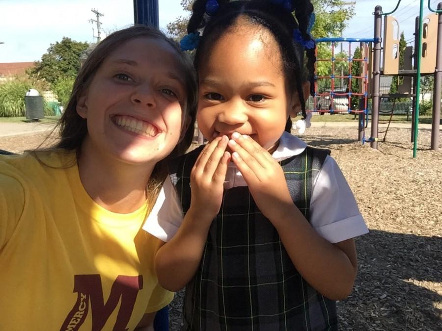 Gesu student Arianna (right) poses with Mercy senior Allia McDowell, hiding her smile from the camera after a long day of playing. (Photo credit: Allia McDowell)