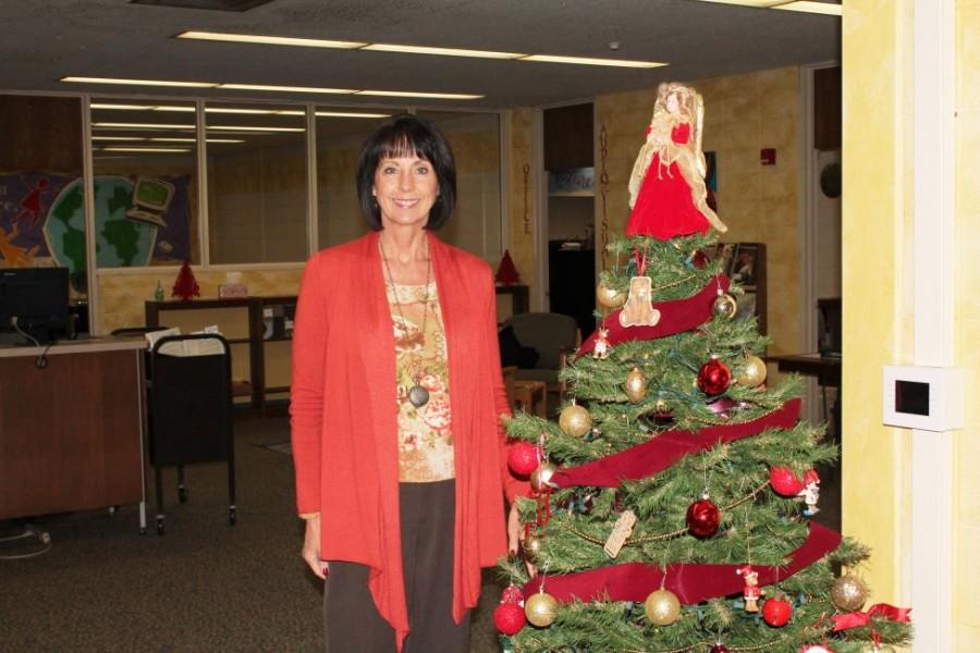 Ms. Cheryl Corte works in the media center when she is not planning service opportunities for the school.  (Photo credit: Jasmine Williams)