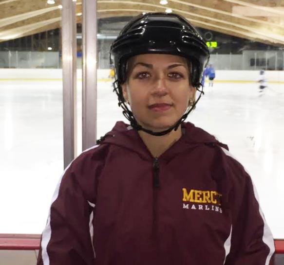 Mrs. Sosnowski works just as hard out on the ice as she does in school, but instead of grading tests or checking in homework, she's running practices and setting up lines. (Photo credit: Caitlin Somerville)