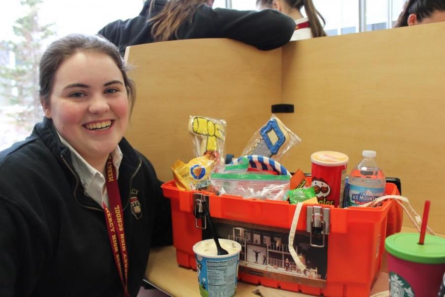 Junior Megan McCarren is all smiles after receiving her lucky lunch from Ms. Eddy. (Photo credit: Caitlin Somerville)