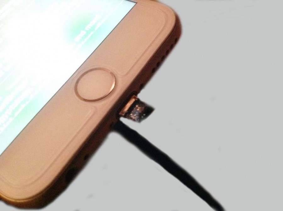 iPhone+charger+burned+off+leaving+charging+tip+inside+iPhone.+When+the+iPhone+became+overheated%2C+the+charger+began+smoking+and+melted+off.+%28Photo+credit%3A+Simone+Rhodes%29