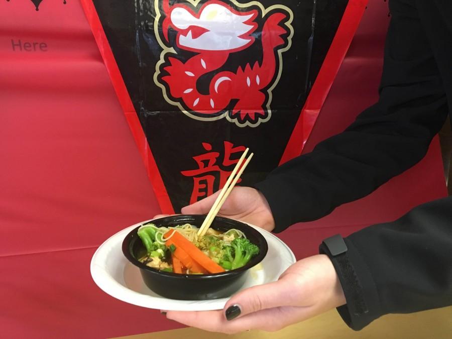 Some students were brave enough to use chopsticks, but others or opted for a traditional utensil. (Photo credit: Bridgette Conniff)