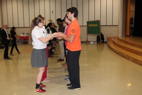 Students line with their partners as they learn the basics of salsa dancing. (Photo credit: Sydney Hughes)