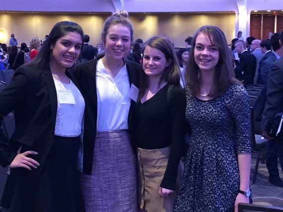 The four delegates who traveled to D.C. pose after coming out of committee. (Photo used with permission from Lucy Devine)