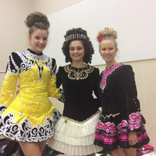 Mercy junior Kathryn Wolf poses with her fellow performers, junior
Annie Acho Tartoni and freshman Bridget D'Amore, dressed in
traditional Irish costumes.