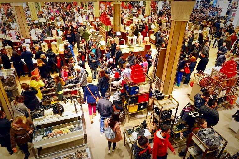 Shoppers crowd every inch of a store while searching top to bottom for the best deals and perfect Christmas gifts. (Photo Credit: Creative Commons Flickr)

