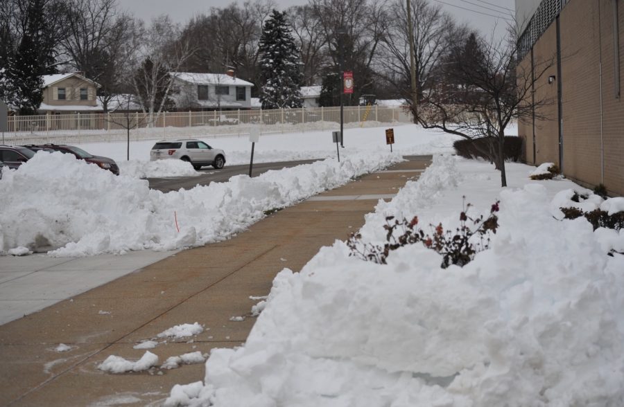 Snow was piled high outside Mercy High School after a recent snow day. (Photo Credit: Clarisa Russenberger)