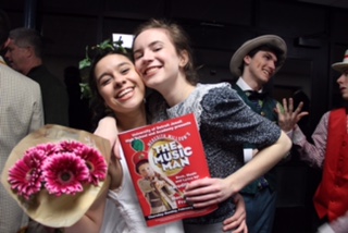 Seniors Claire Alafita and Ann Nelson embrace on opening night of U of D’s performance of The Music Man. The musical was performed Thursday-Sunday, Feb. 23-26. (Photo Credit: Brooklyn Rue)