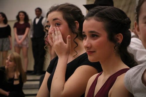 Seniors Regan Castle and Edie Jones are moved to tears after hearing how much Mercy theater has impacted Aim High senior Jonathan Stecevic’s life.
