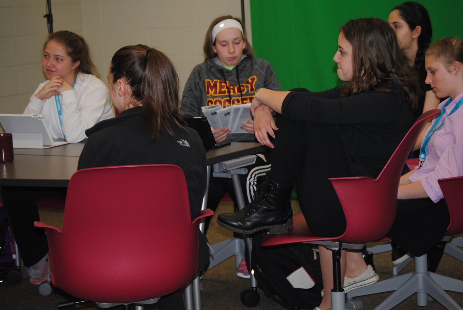 iWizard members discuss upcoming events and plans for next year,
including freshman orientation. (Photo Credit: Megan Hutter)
