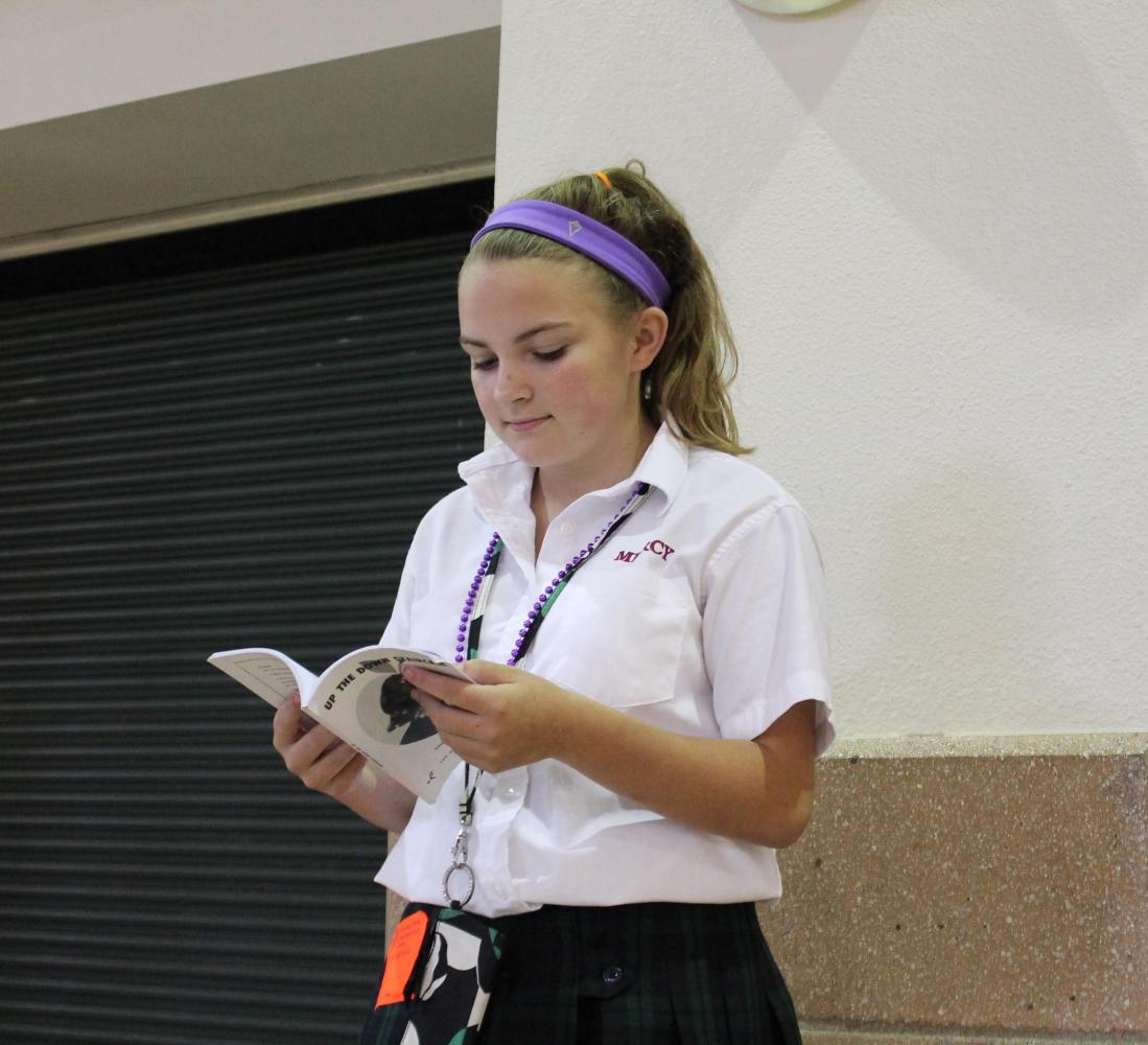 Freshman Lindsey Walton studies her script during one of the daily after-school rehearsals. With upcoming performances approaching quickly, the cast is working on memorizing lines and cues so that script books become unnecessary. (Photo Credit: Shannon Seabolt)