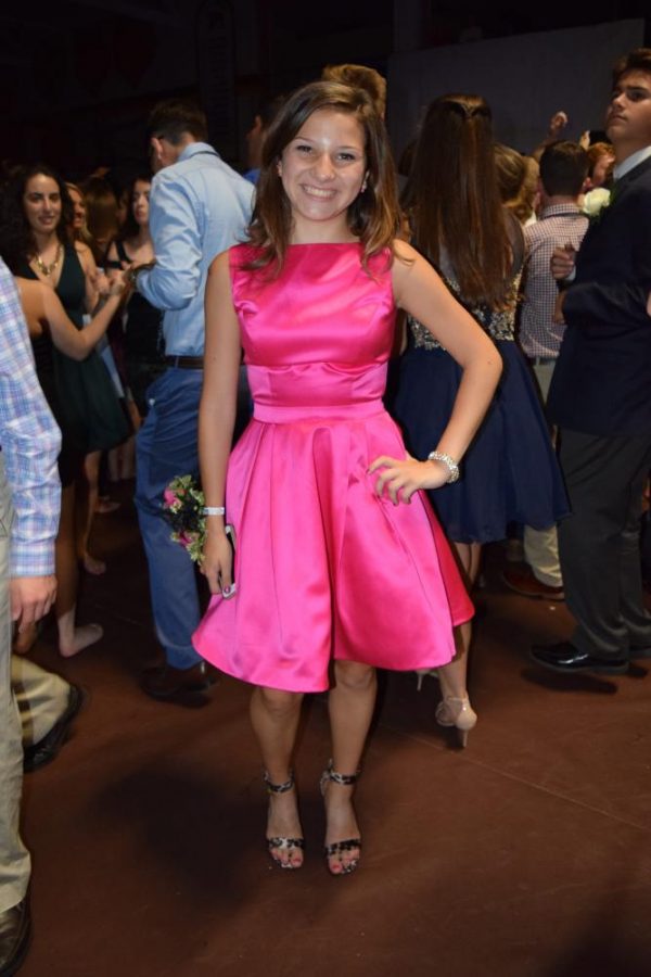 Sophomore Gabby Pluszcynski fashions a bright pink dress from Sherry Hill, fierce cheetah print heels from Six, and a sparkling bracelet from Kate Spade. 