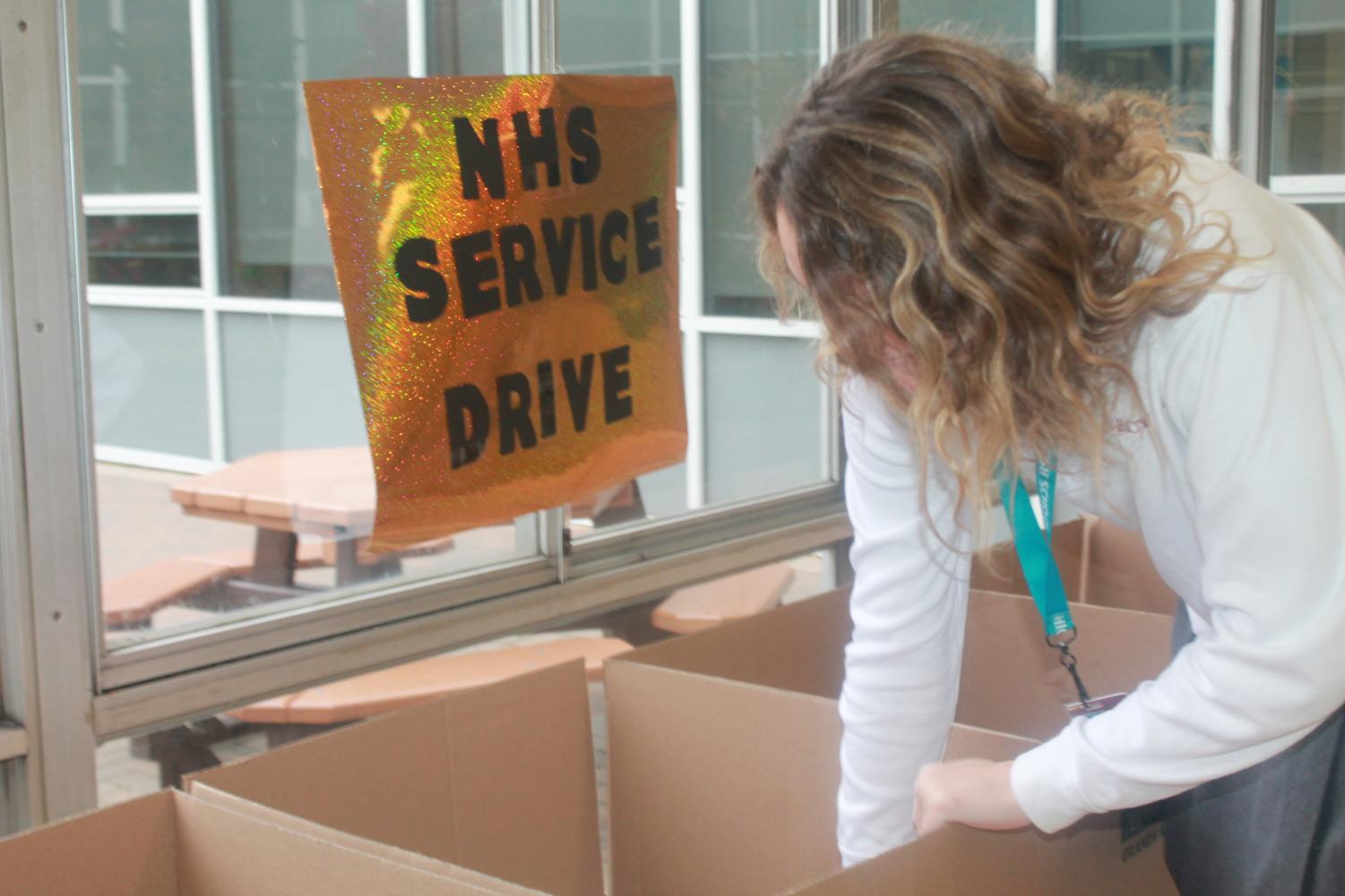 Senior Emily Engler donates her clothing with a feeling of pride and fulfillment. “It feels really good to help the people that need our support and our donations,” said Engler. (Photo Credit: Emma Tomsich)
