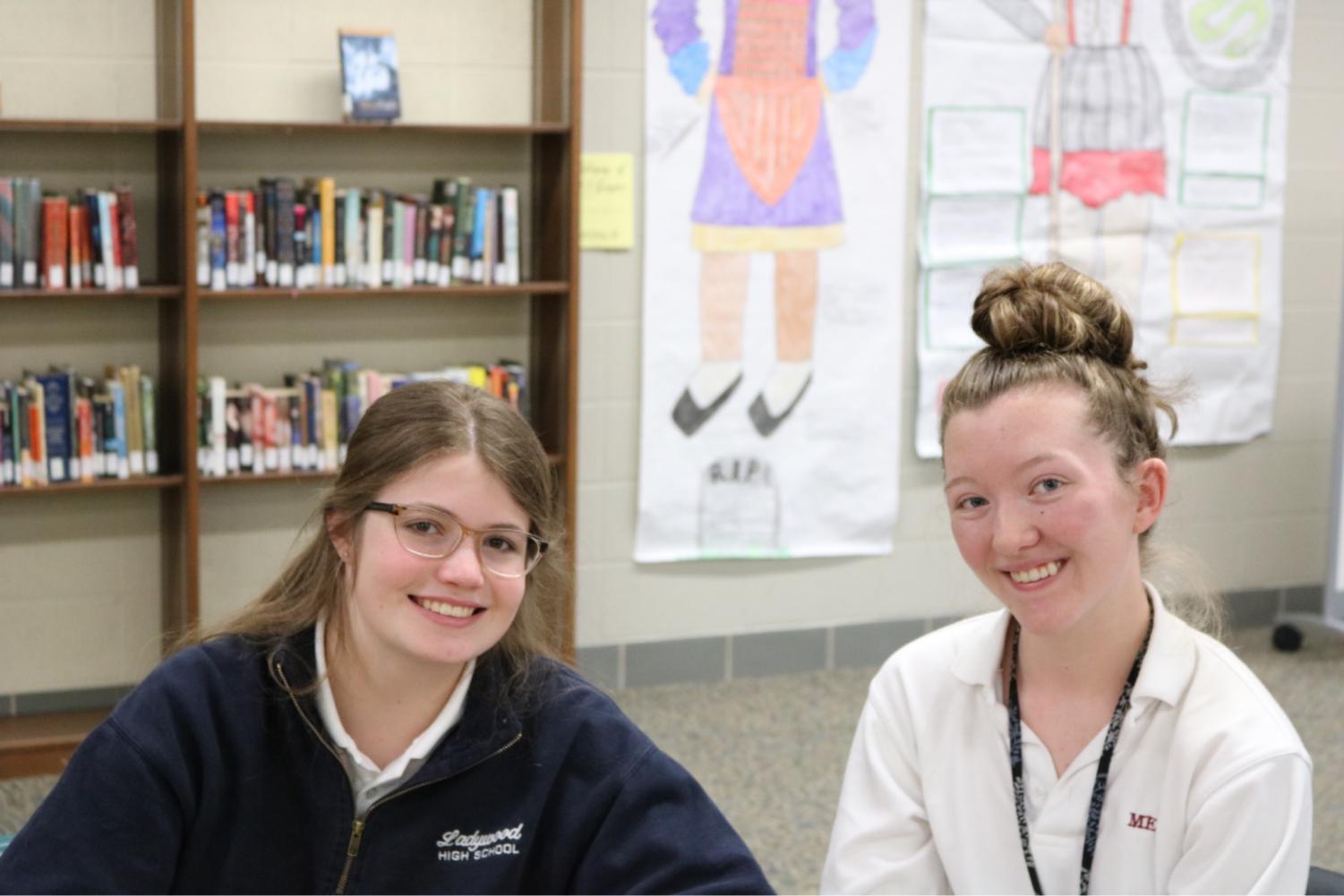 Junior Jess Dillon spends an off hour in the media center explaining the schedule, classes, and clubs to her ladywood shadow.