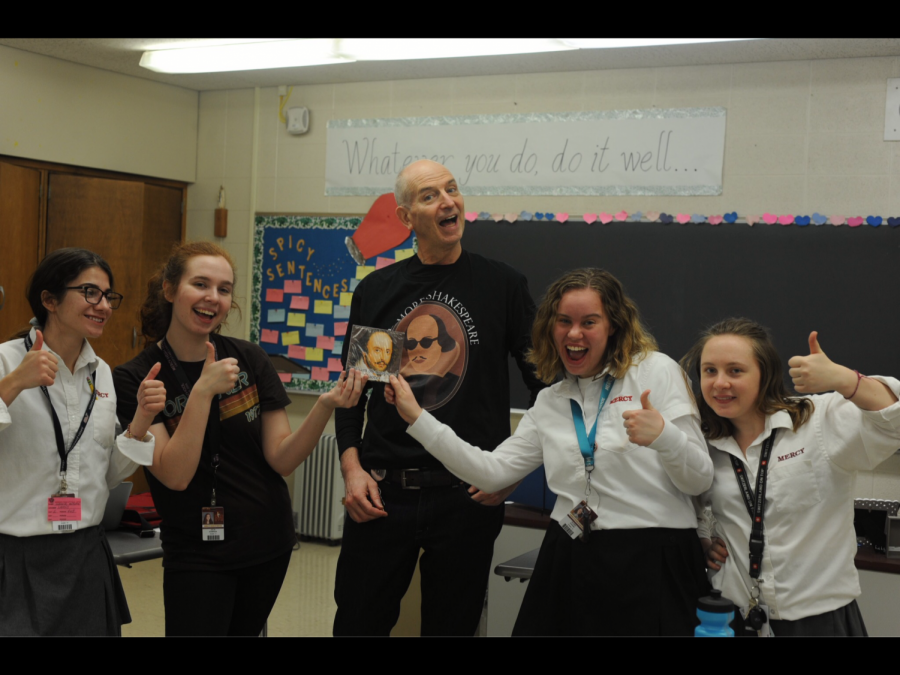 The winning team from the Shakespeare-themed scavenger hunt pose with Mr. Larry Baker and their prize, a box of Shakespeare chocolates. Although the Shakespeare Society has only seven students this year, the group has plenty of fun. (Photo Credit: Anastasia Warner)