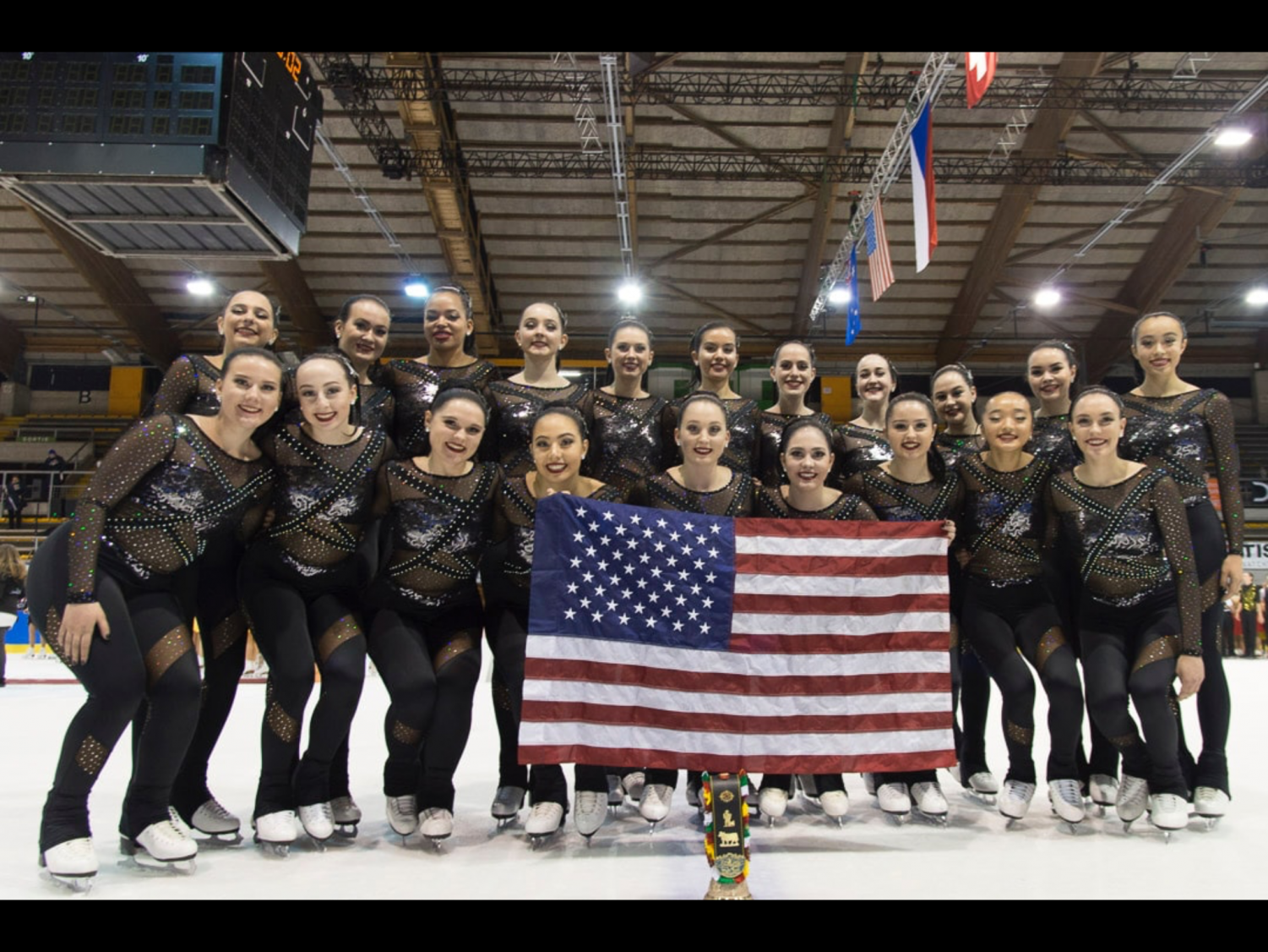 Corinne Fereshetian smiles with Team USA after a successful skate. (Photo reprinted with permission of Corinne Fereshetian.)