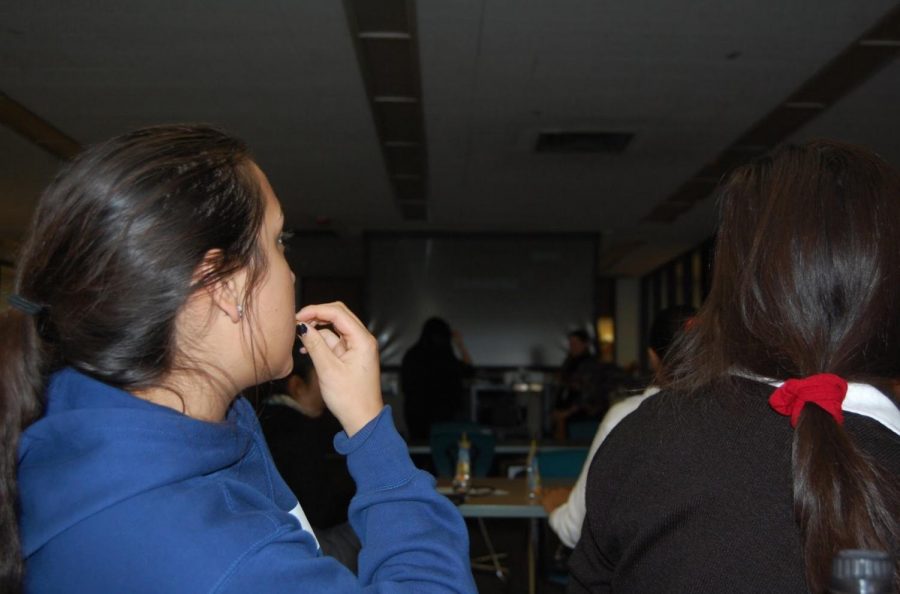 Juniors Frannie Lauck (left) and Jenny Jaramillo (right), members of SHH, gather in the Media Center to view the film Coco at the first fiesta of the school year.
Photo by Carrie Jefferson