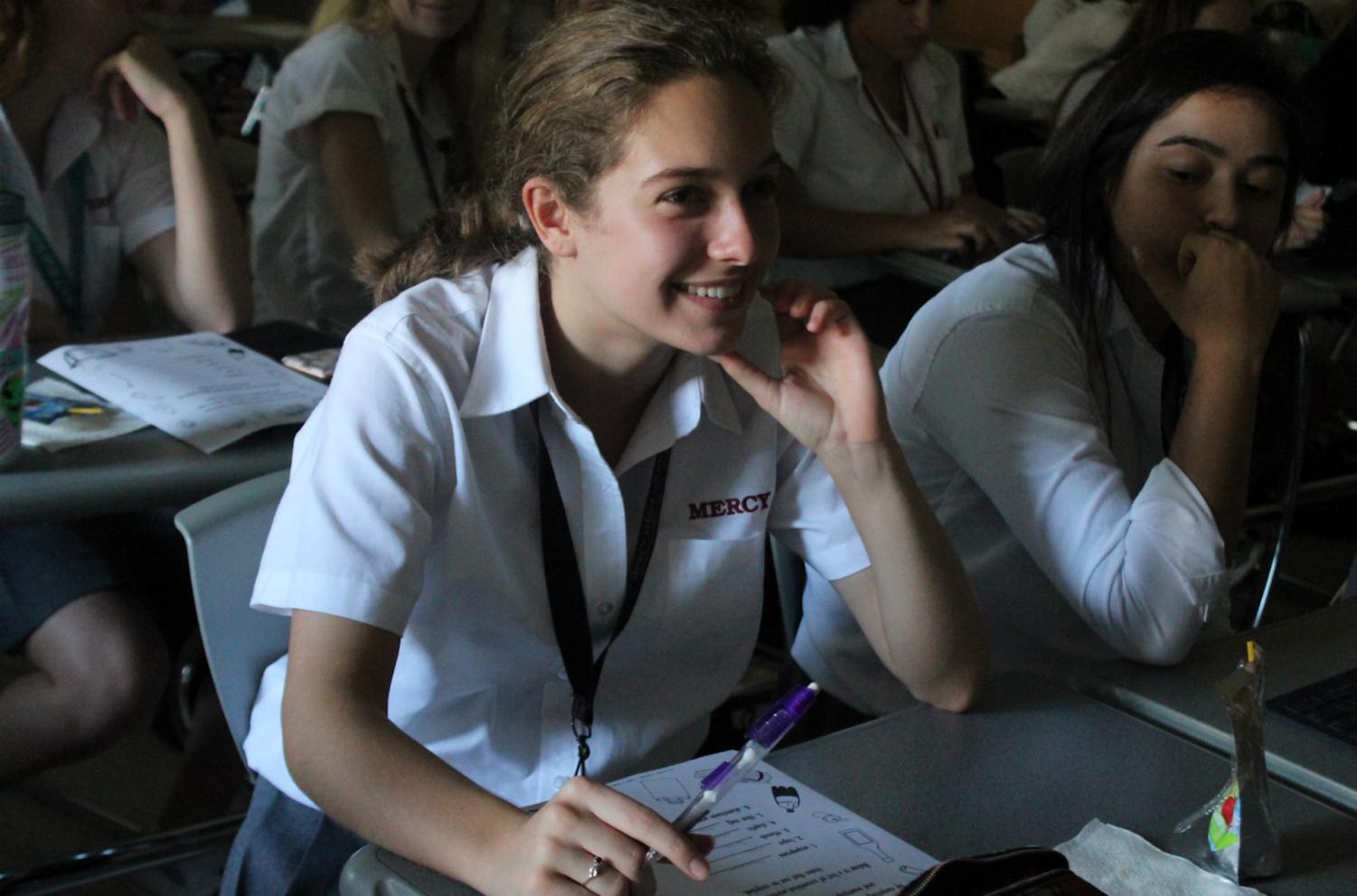 Junior Emily Cascalou listens to a lecture about how plastic straws are affecting the planet in Mercy’s Green Club.
Photo by Dunya Kizy