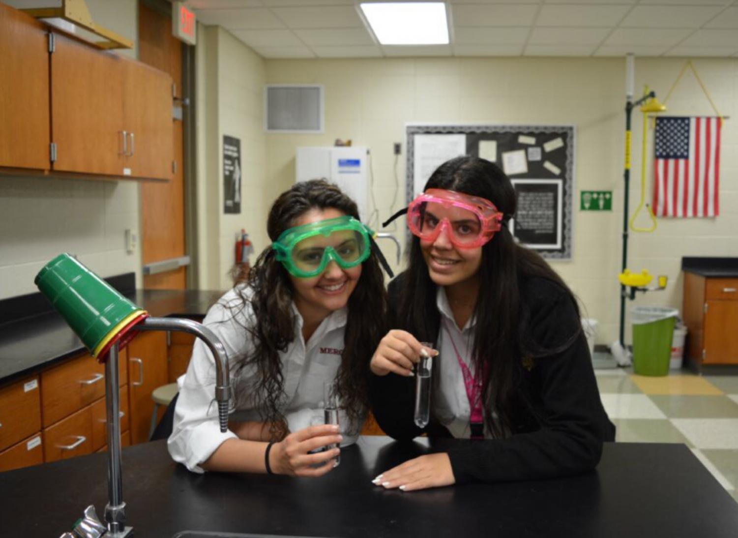 Seniors Christina Thomas and Abby Najar had a successful first meeting building paper airplanes to go with the flight theme. Photo by Alyssa Johnston