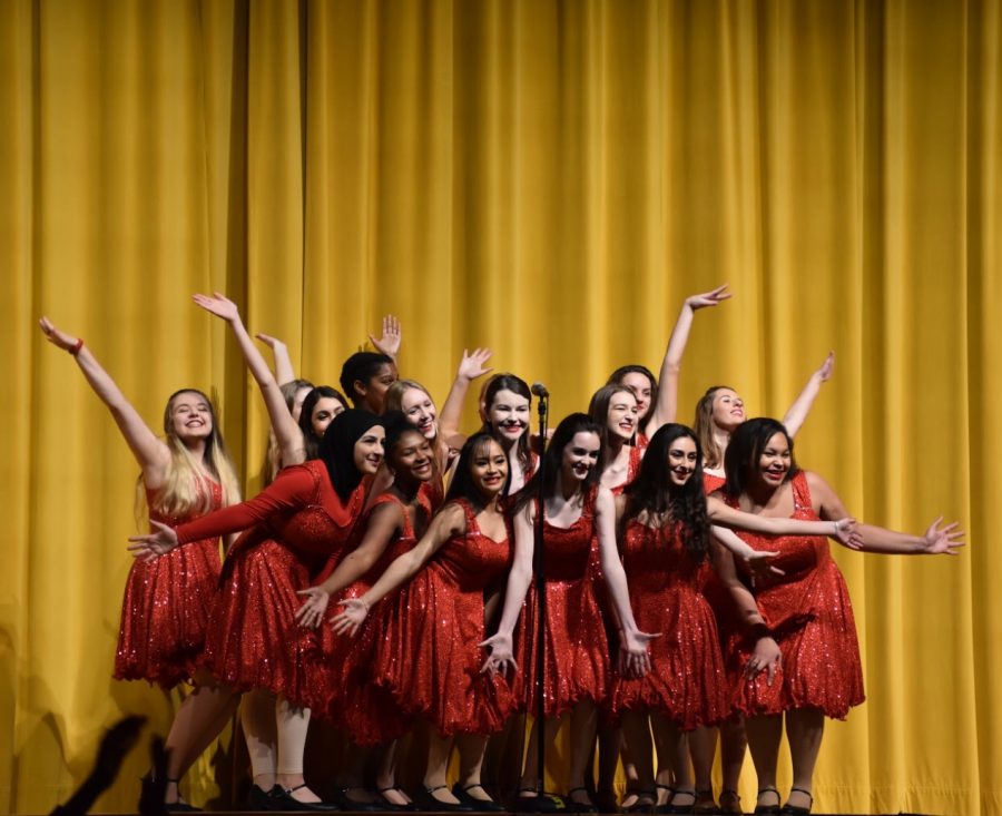 Mercyaires are in unison from their harmonious voices down to their sparkling red dresses. This year at the Christmas assembly they sang “White Christmas.” 
Photo by Mary McGreevy