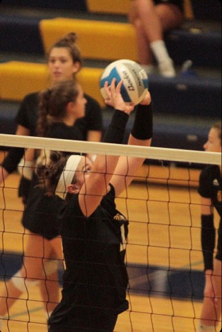 Senior Julia Bishop goes to set the ball for a teammate.