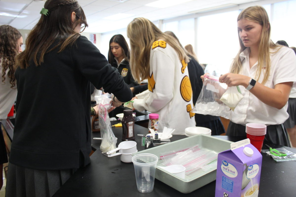 Science Club students make ice cream during their meeting.  Fourteen clubs met Friday for the first time this school year.