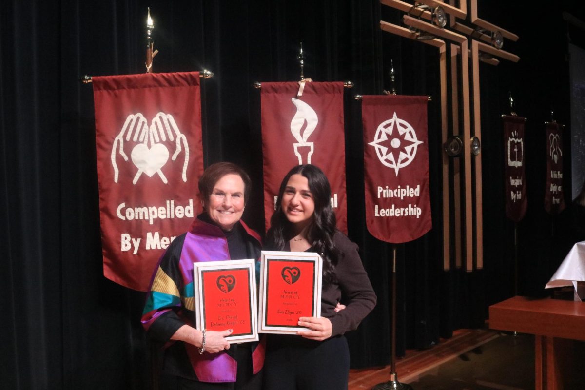 Ava Elyia ‘26 and Dr. Kreger ‘66 pose with their Heart of Mercy awards proudly. 